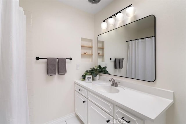 bathroom with a shower with curtain and vanity