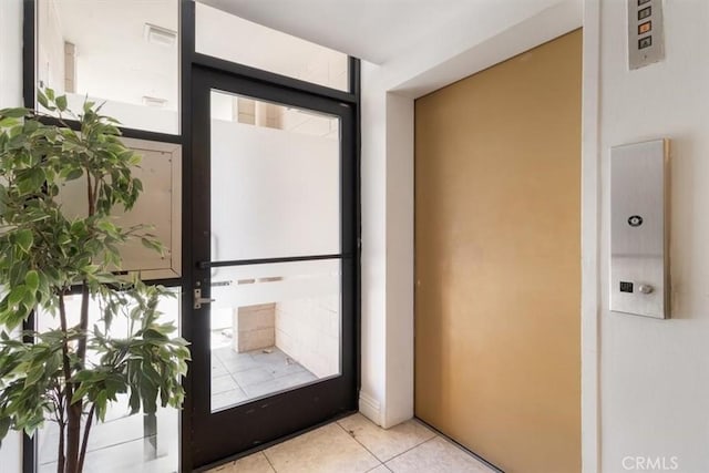 entryway featuring light tile patterned flooring