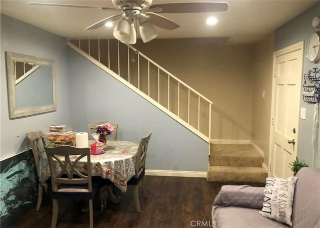 dining space featuring dark hardwood / wood-style flooring and ceiling fan