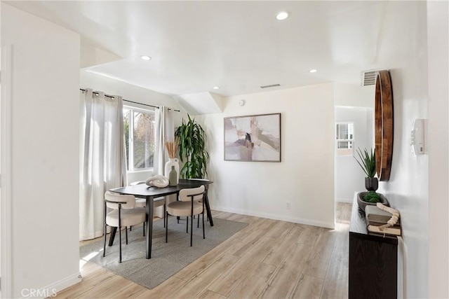 dining space featuring light hardwood / wood-style flooring