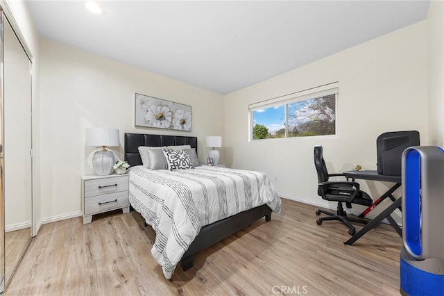 bedroom with light hardwood / wood-style floors