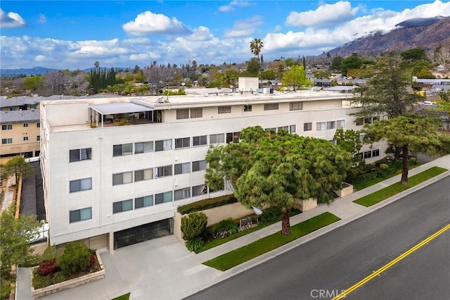 view of building exterior featuring a mountain view