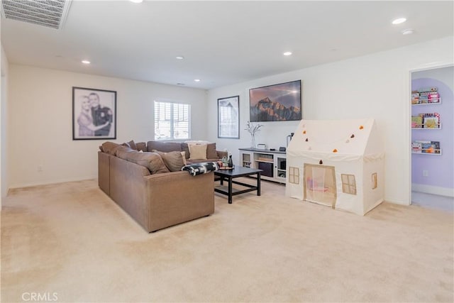 living room with baseboards, visible vents, light colored carpet, and recessed lighting