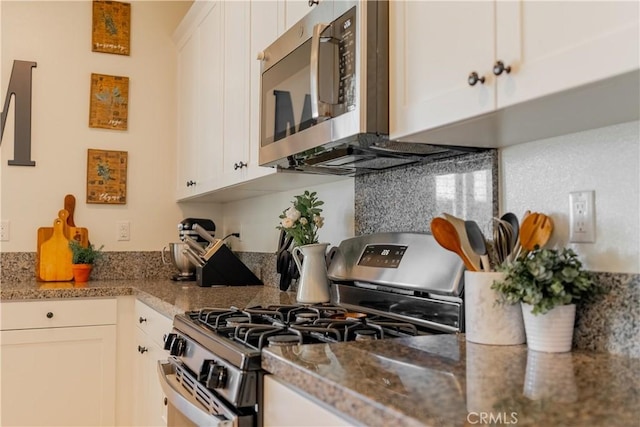 kitchen featuring appliances with stainless steel finishes and white cabinetry