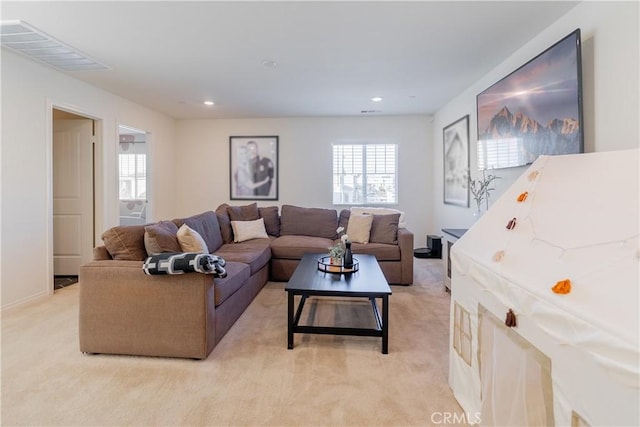 living area with visible vents, light colored carpet, and recessed lighting