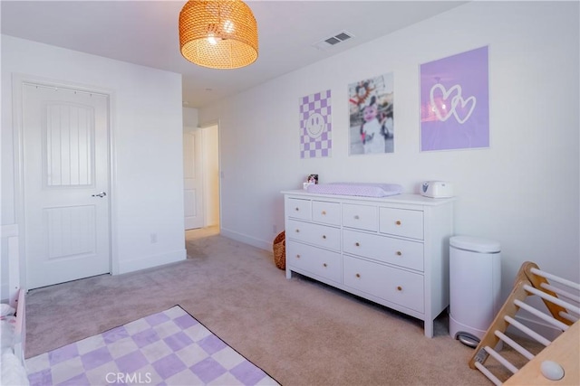 bedroom featuring light carpet, baseboards, and visible vents