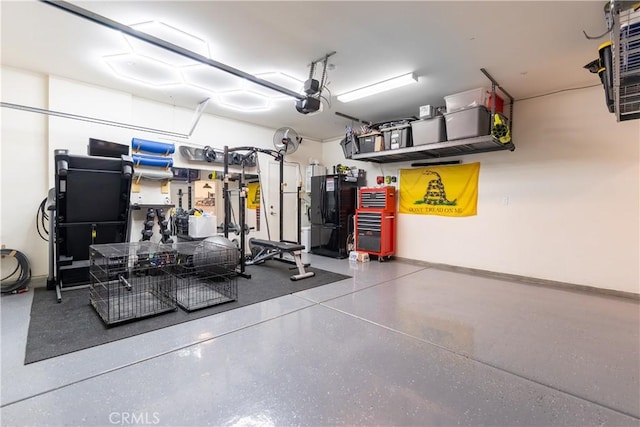 garage with a garage door opener and baseboards