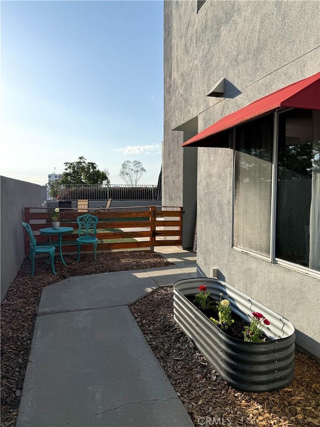 view of patio with fence