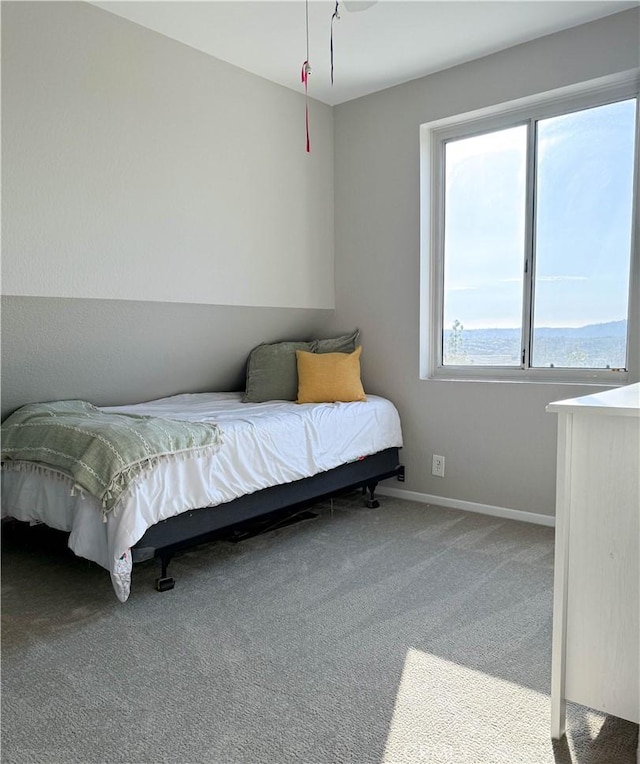 bedroom with carpet and baseboards