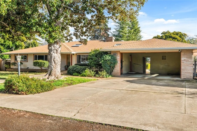 ranch-style house featuring a carport