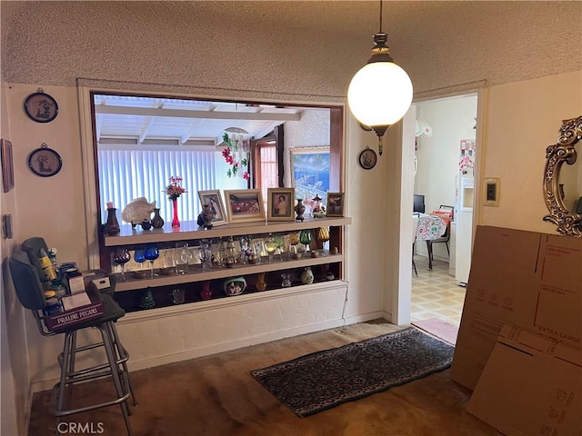 interior space with white fridge with ice dispenser