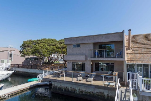 rear view of house with a water view