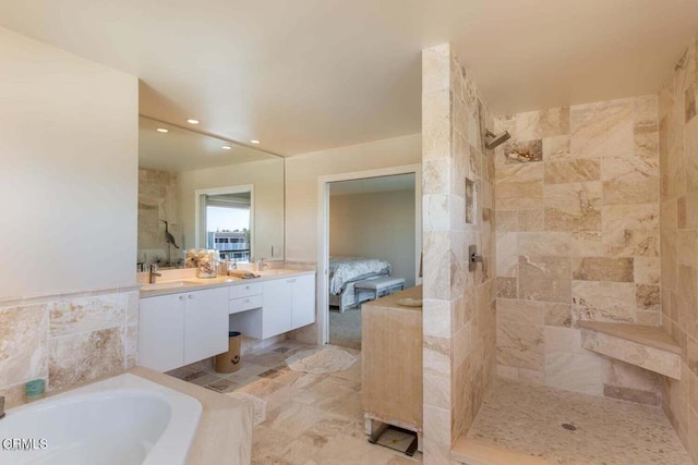 bathroom featuring vanity and plus walk in shower