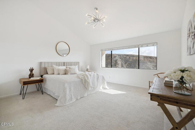 bedroom with high vaulted ceiling, carpet floors, and a chandelier