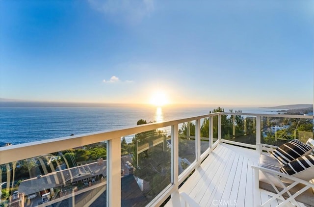 balcony at dusk with a water view