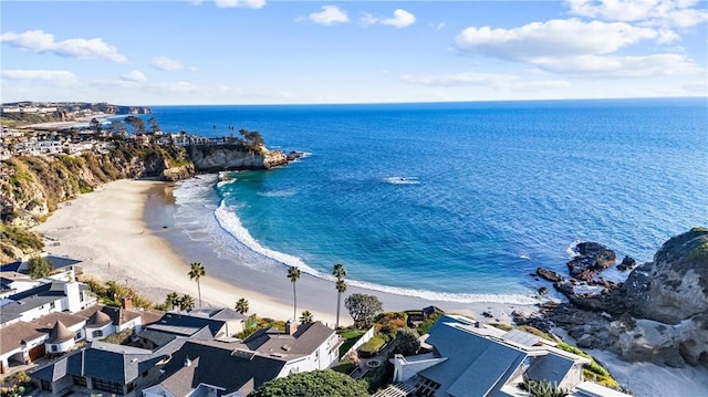 aerial view featuring a water view, a residential view, and a view of the beach