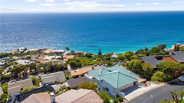 birds eye view of property featuring a water view and a residential view