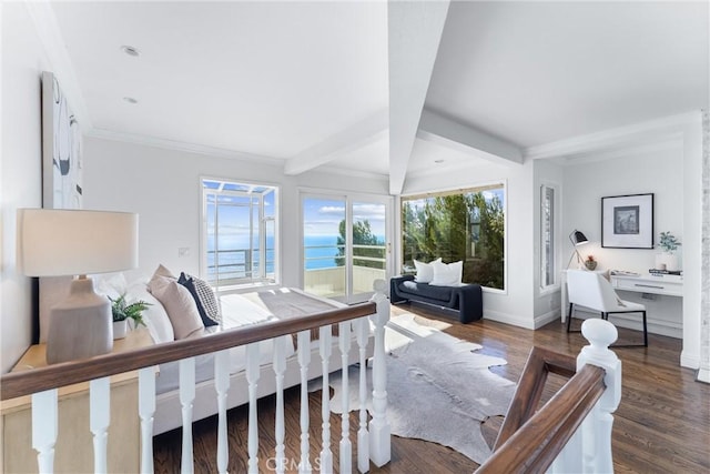 bedroom with beam ceiling, a water view, dark wood-style flooring, and multiple windows