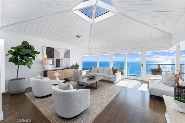 living room with a skylight, a water view, visible vents, wood finished floors, and high vaulted ceiling