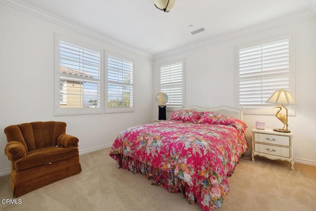 bedroom featuring ornamental molding and light carpet