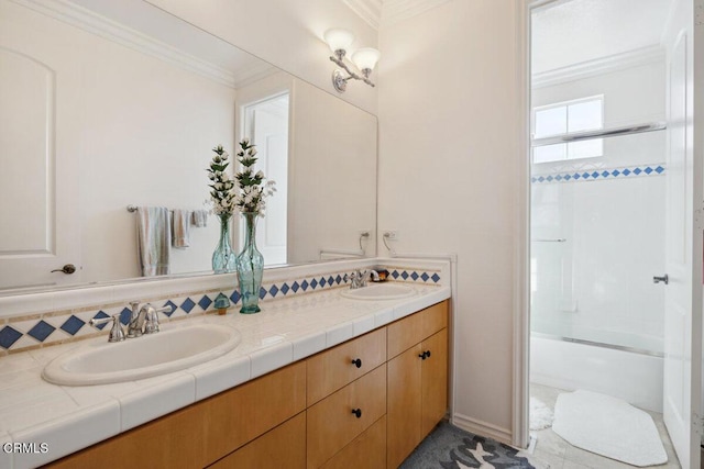 bathroom with vanity, ornamental molding, and shower / bath combination with glass door