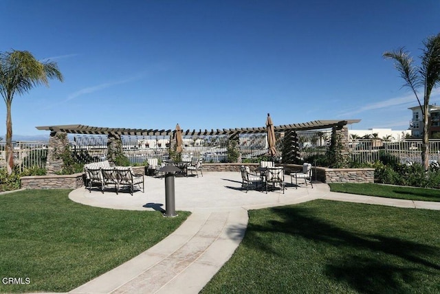 view of home's community featuring a yard and a patio area