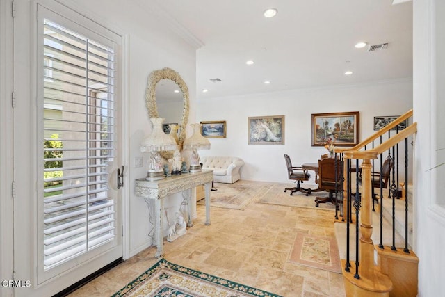 foyer entrance featuring ornamental molding