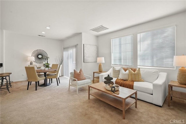 living room featuring light colored carpet