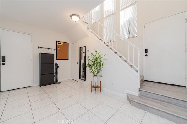 entrance foyer featuring light tile patterned floors