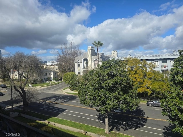 1223 Roxbury Dr Unit 305, Los Angeles, CA 90035 - view of asphalt road with sidewalks and curbs