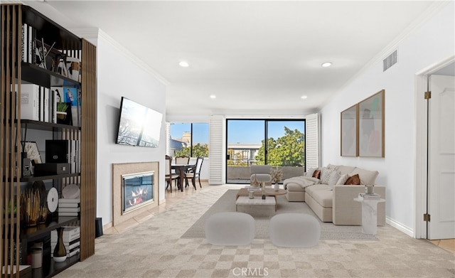 carpeted living area with tile patterned flooring, visible vents, and crown molding