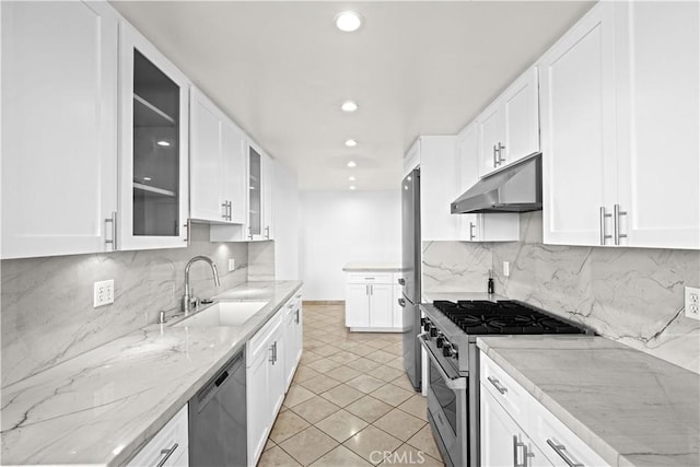 1223 Roxbury Dr Unit 305, Los Angeles, CA 90035 - kitchen with under cabinet range hood, stainless steel appliances, white cabinets, and recessed lighting