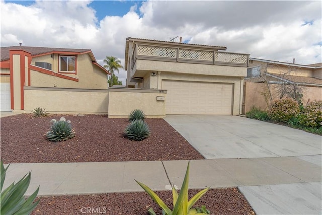 view of front of home featuring a garage and a balcony