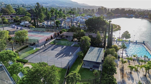 birds eye view of property featuring a water and mountain view