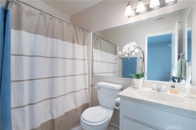 full bathroom featuring vanity, shower / tub combo, and toilet