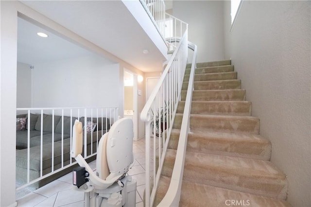 stairway featuring tile patterned floors