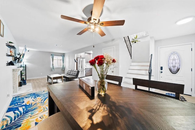 dining space featuring ceiling fan and light hardwood / wood-style floors