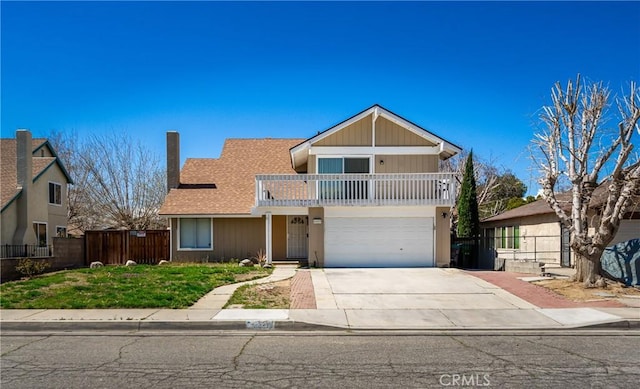 view of front property featuring a garage and a balcony