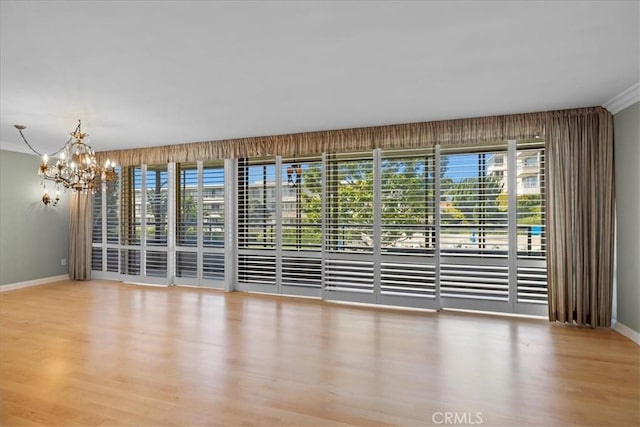 32709 Seagate Dr Unit 101, Rancho Palos Verdes, CA 90275 - spare room with a chandelier, baseboards, and wood finished floors