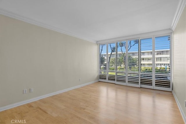 32709 Seagate Dr Unit 101, Rancho Palos Verdes, CA 90275 - spare room featuring ornamental molding, baseboards, and light wood-style floors