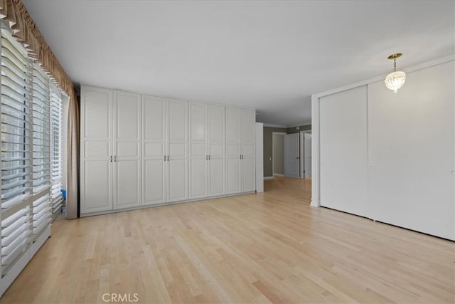32709 Seagate Dr Unit 101, Rancho Palos Verdes, CA 90275 - unfurnished bedroom featuring light wood finished floors and ornamental molding