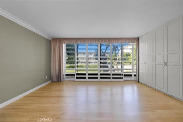 32709 Seagate Dr Unit 101, Rancho Palos Verdes, CA 90275 - unfurnished bedroom with light wood-style floors, crown molding, and baseboards