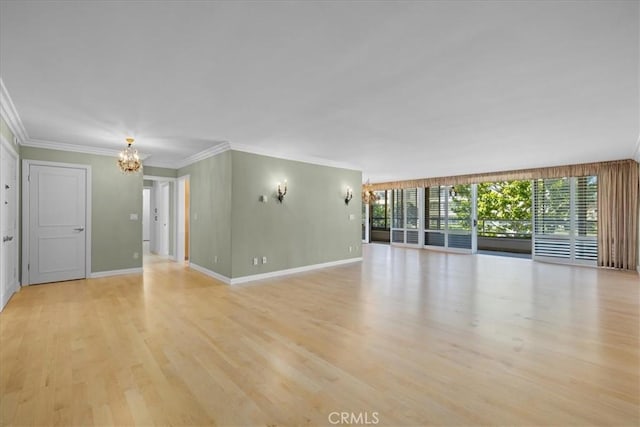 32709 Seagate Dr Unit 101, Rancho Palos Verdes, CA 90275 - unfurnished living room featuring a chandelier, light wood finished floors, ornamental molding, and baseboards