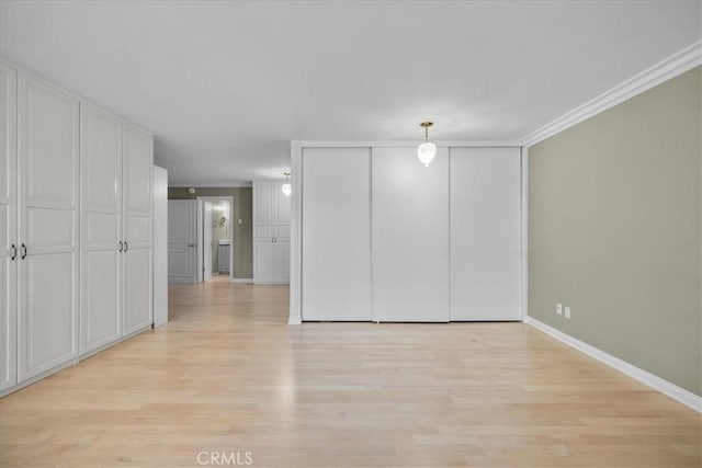 32709 Seagate Dr Unit 101, Rancho Palos Verdes, CA 90275 - unfurnished bedroom featuring light wood finished floors, ornamental molding, and baseboards
