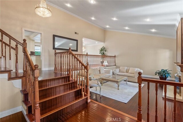 1885 Fallview Rd, Westlake Village, CA 91361 - stairway featuring crown molding, wood finished floors, and recessed lighting
