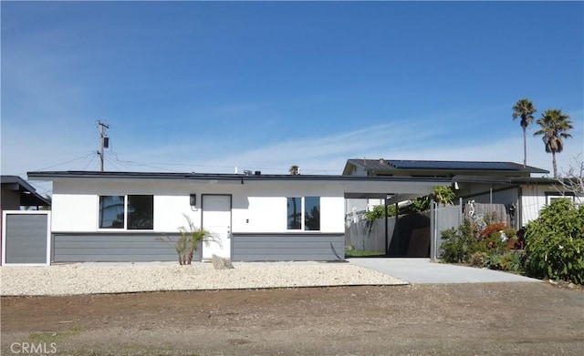 view of front of home featuring a carport