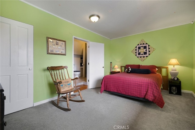 bedroom with ornamental molding and carpet