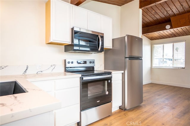 kitchen with light stone counters, light hardwood / wood-style flooring, wooden ceiling, stainless steel appliances, and white cabinets