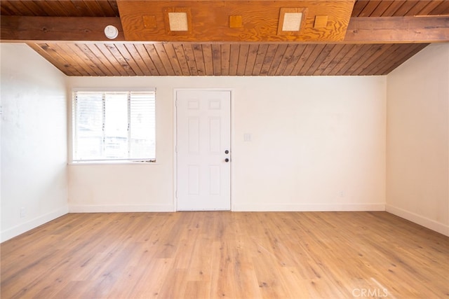 spare room with wood ceiling, baseboards, light wood-style flooring, and lofted ceiling with beams