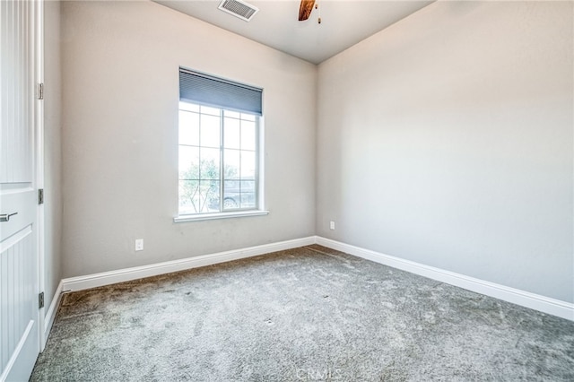 unfurnished room featuring ceiling fan and carpet floors